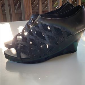 Strappy black leather wedges